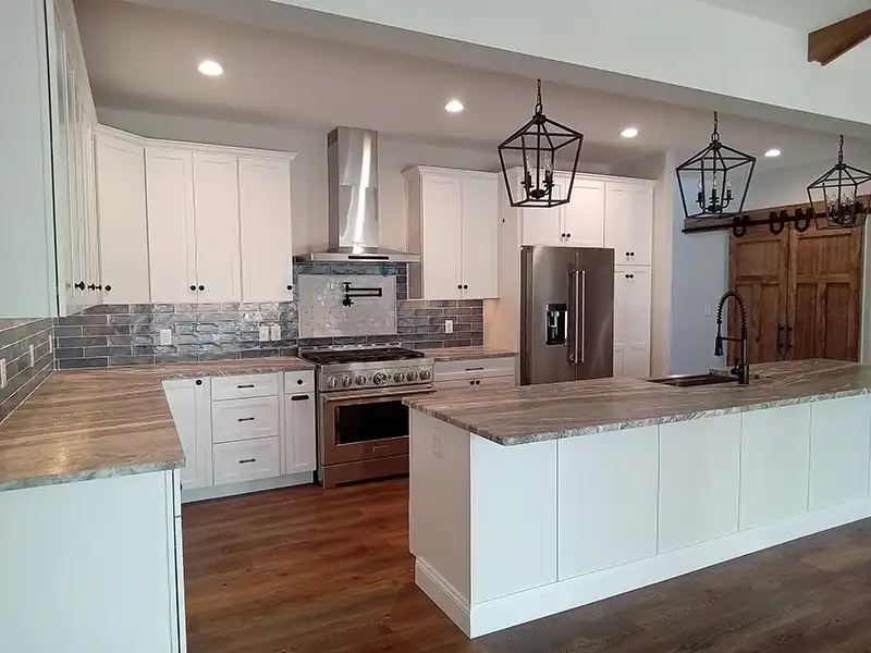 Modern kitchen space with white cabinets